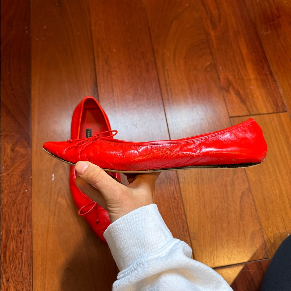 Red pointed toe flats with bow